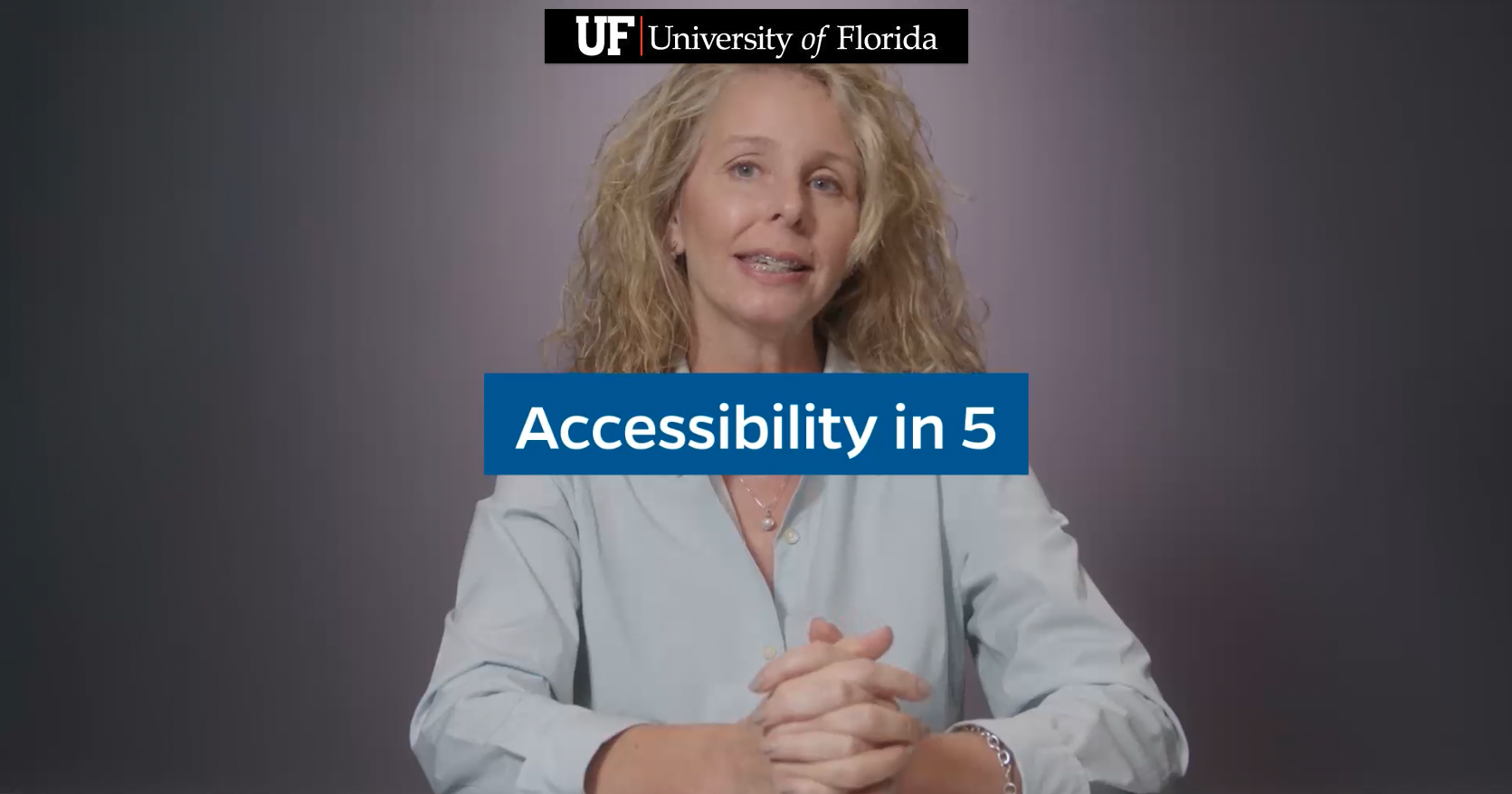 Still from video showing a woman in business clothes with overlay that says Accessibility in 5.